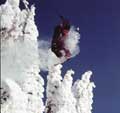 Snowboarder flying thru the snowghosts of Big Mtn